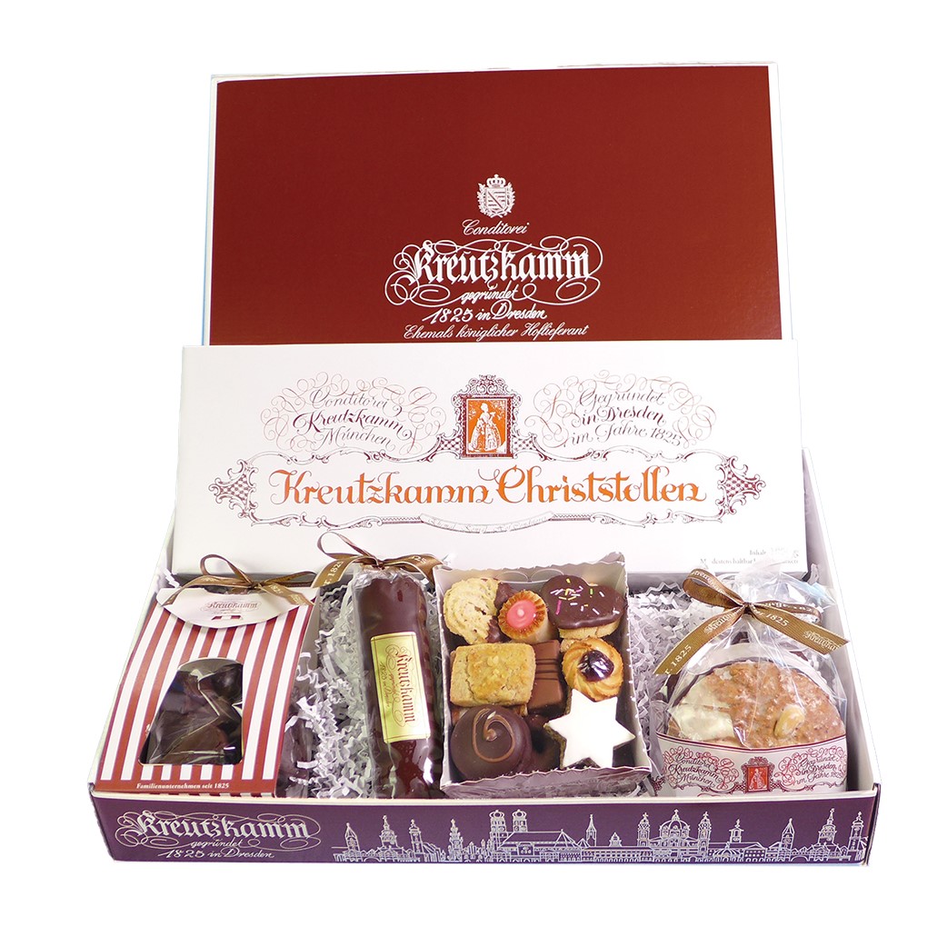 Geschenkbox mit verschiedenen Suessigkeiten von Konditorei Kreutzkamm, verziert und verpackt. Text: 